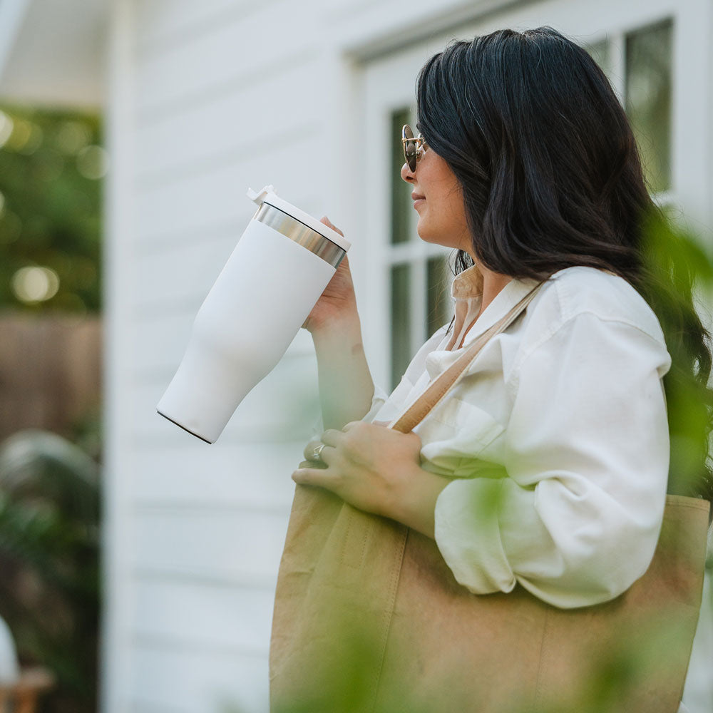 Lady holding a white 40oz Bison Tumbler